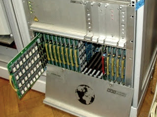 Silver globe player box with front cover removed, exposing memory cards inside