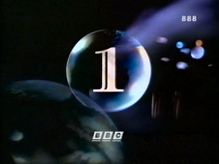 Snapshot of the 1991 BBC 1 globe - a clear glass-like sphere has a large '1' inside with blue light hitting the surface (21K)