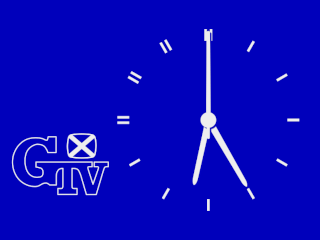White on blue analogue clock with 'GTV' and Scottish flag bottom left