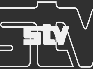 Light STV logo centred on a dark background with a large outline of the logo superimposed