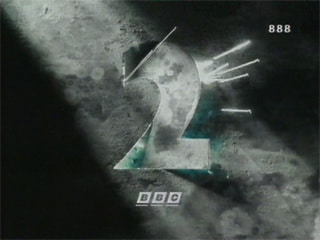 A mostly black-and-white version of the previous image with sparks coming through a gap in a copper surface (17K)