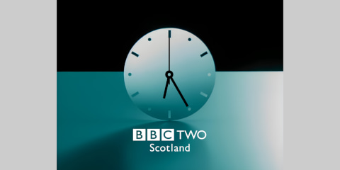 Clock with BBC TWO Scotland underneath on a black and teal background